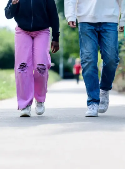 A boy and girl walking on the street